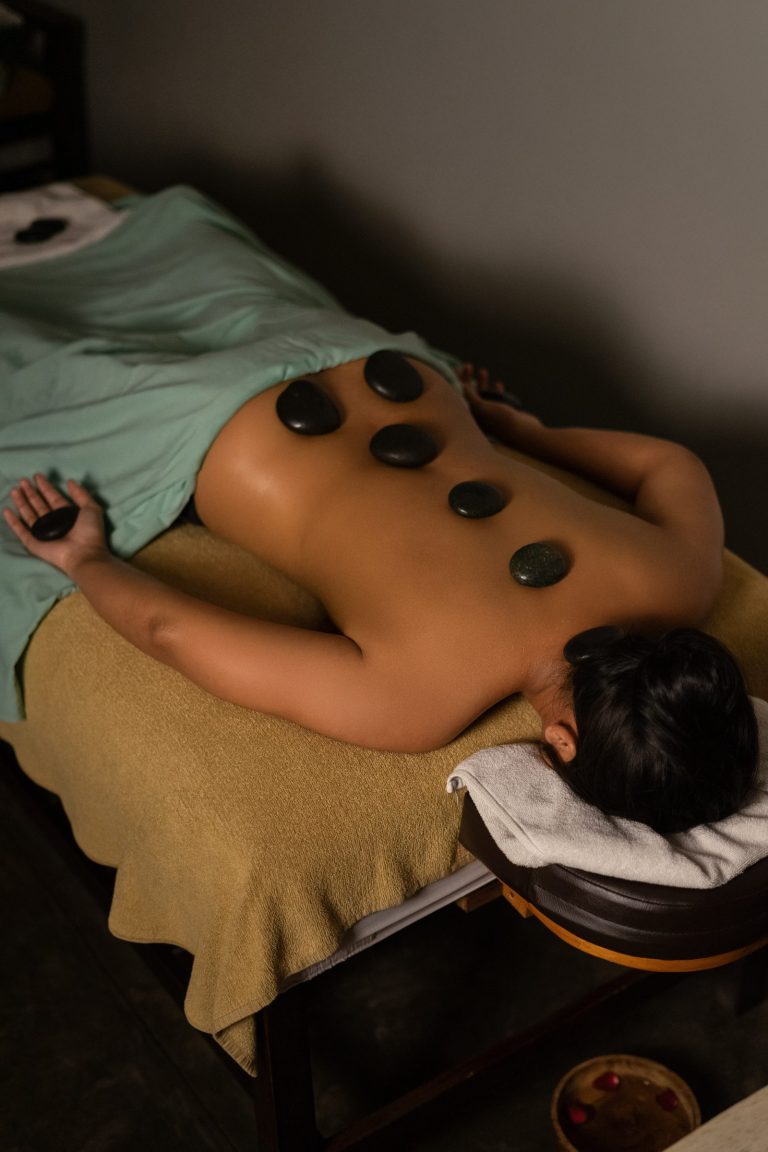 Guest relaxing during a hot stone treatment
